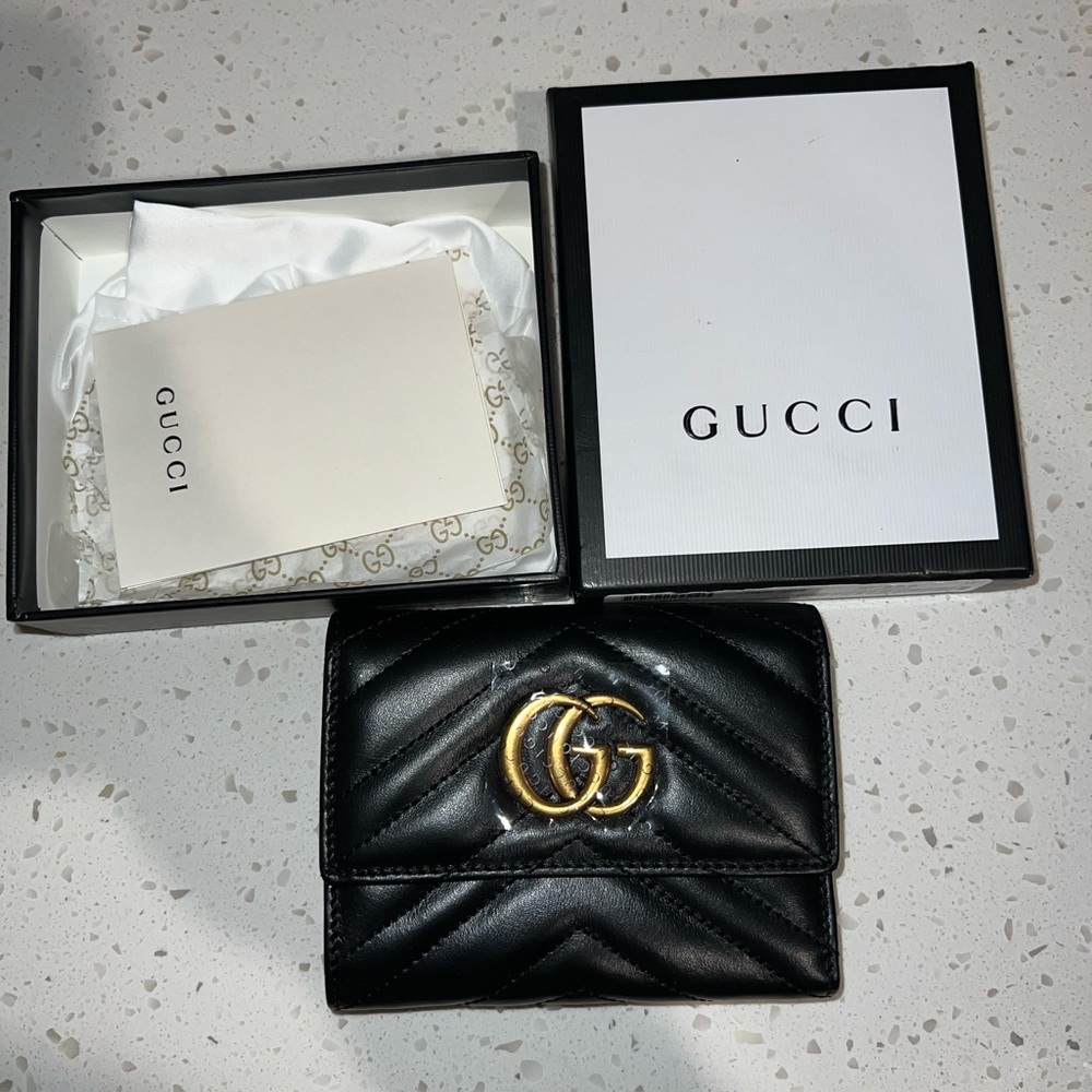 Gucci Black and Gold Wallet with Iconic GG Logo